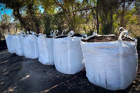 bulk bags filled with biochar soil amendment outdoors