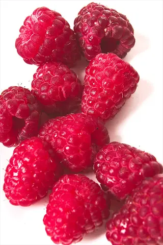 close-up of fresh red himbo top raspberry fruit on a white background