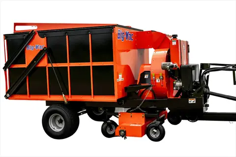 orange electric leaf shredder hopper with trailer wheels and big-vac branding